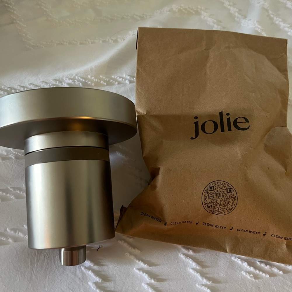 Almost brand new Jolie shower head and brand new unopened filter